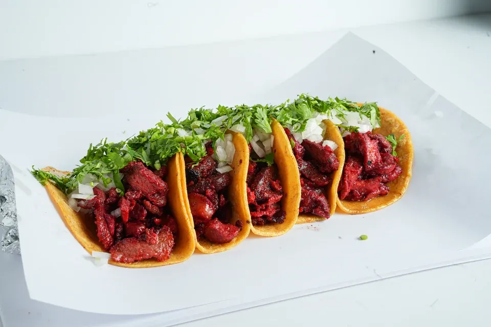 Vitali trompo tacos with onion and cilantro
